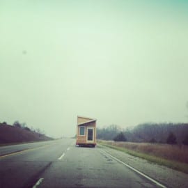 tiny house on a big road